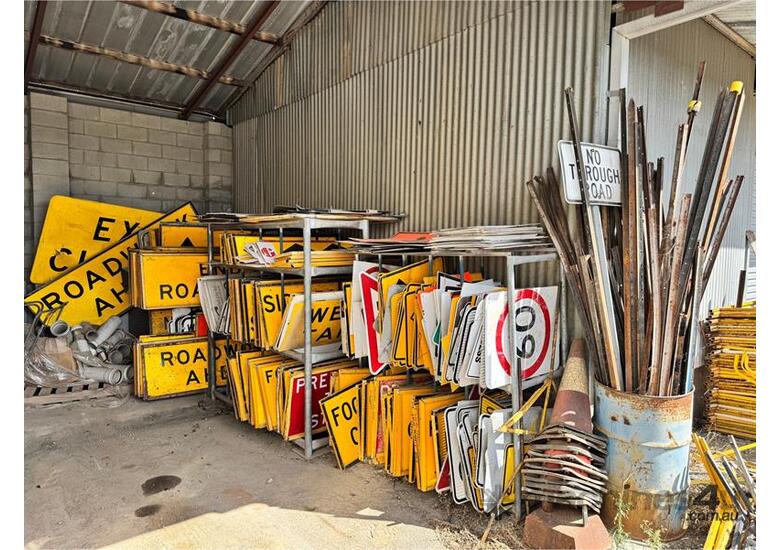 caption HUGE QTY OF ROAD SIGNS ETC