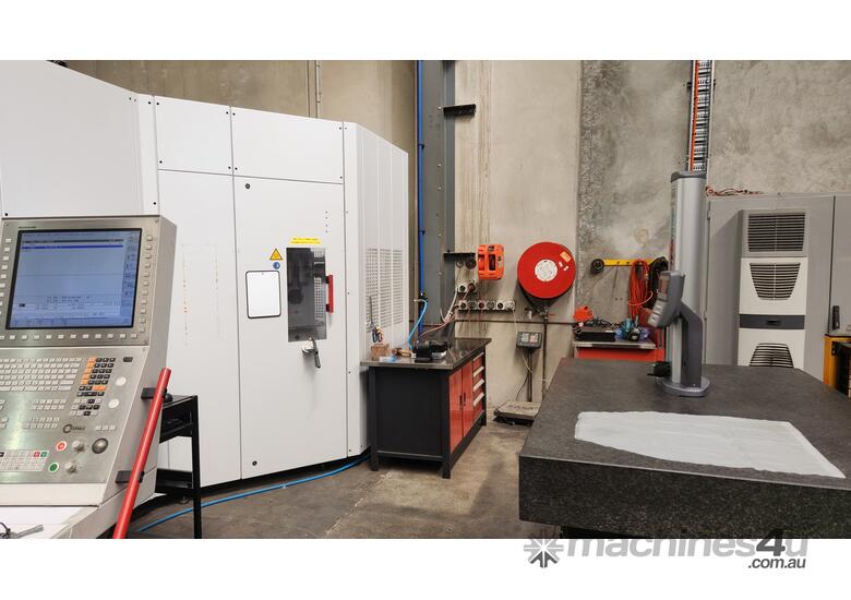 caption Hermle C42U Dynamic 5 axis CNC Vertical machining Centre with 6-station pallet pool.