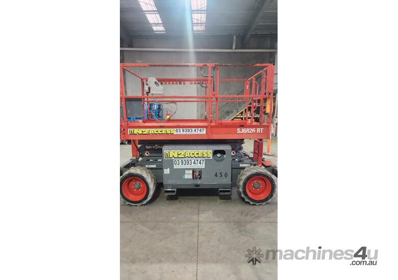 caption Skyjack SJ6826RT Rough Terrain Scissor Lift