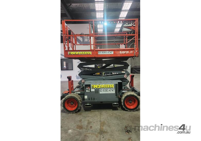 caption Skyjack SJ6826RT Rough Terrain Scissor Lift