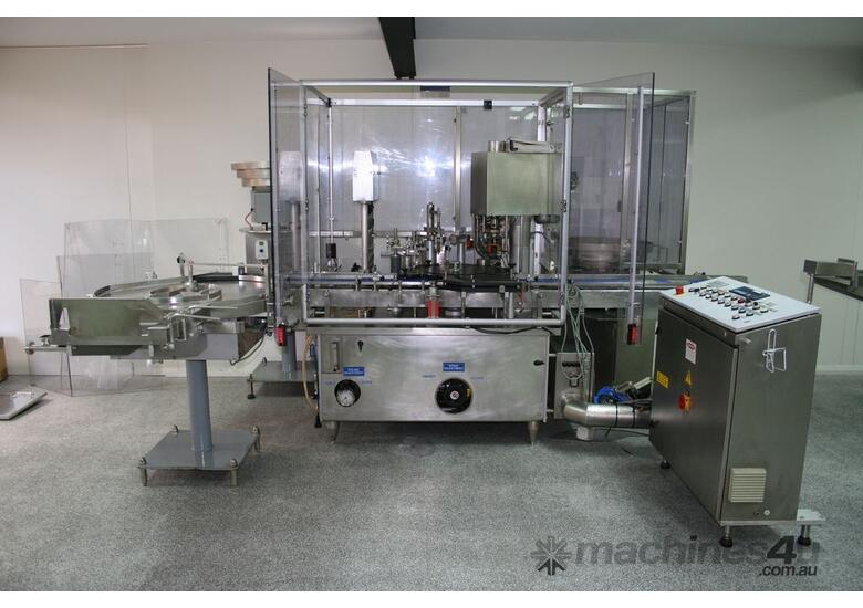 caption Fully Automatic Vials Filling & Closing Machine