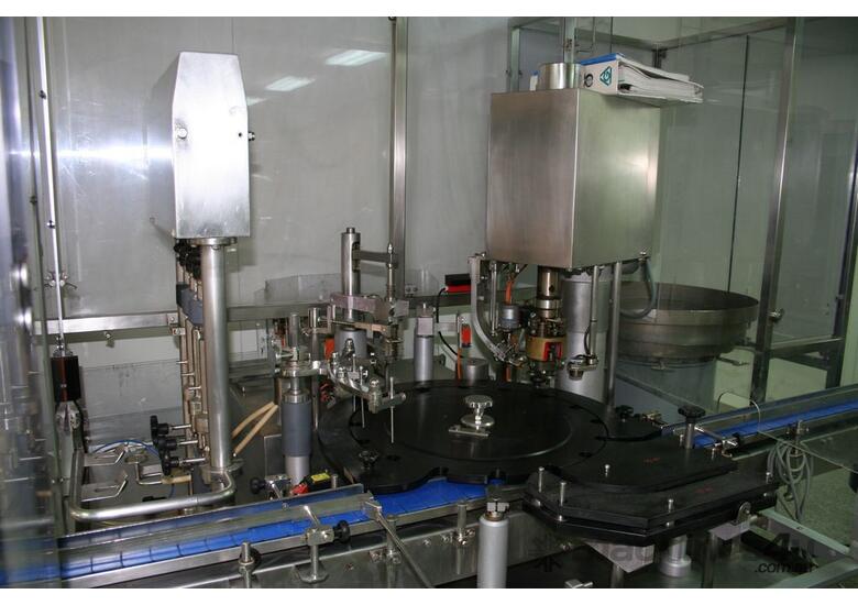caption Fully Automatic Vials Filling & Closing Machine