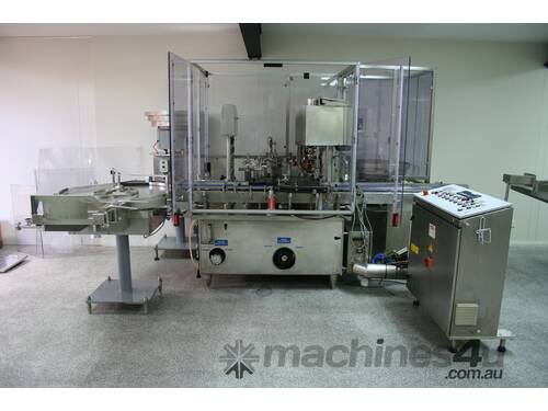 caption Fully Automatic Vials Filling & Closing Machine