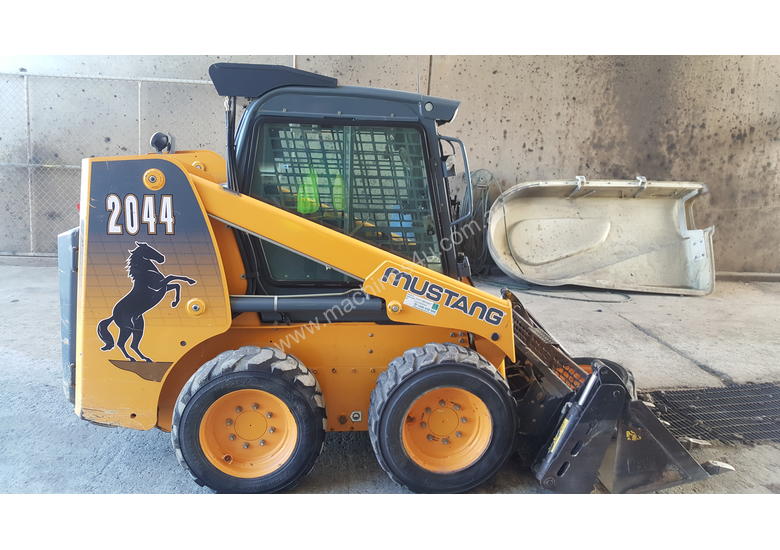 caption Used A/C Cab, T-Bar Steering, 4 in 1 Bucket Mustang 2044 Skid Steer