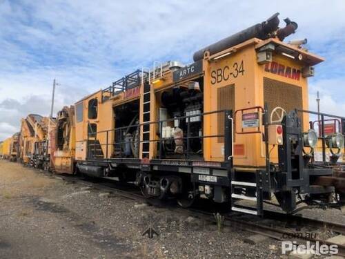 Circa 2013 Loram Shoulder Ballast Cleaner	
Model: SBC354	
Gauge: 1,435mm (Standard)	
Weights & Lengt