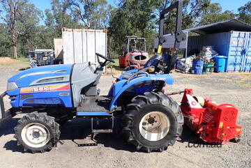Tractor with mulcher/mower