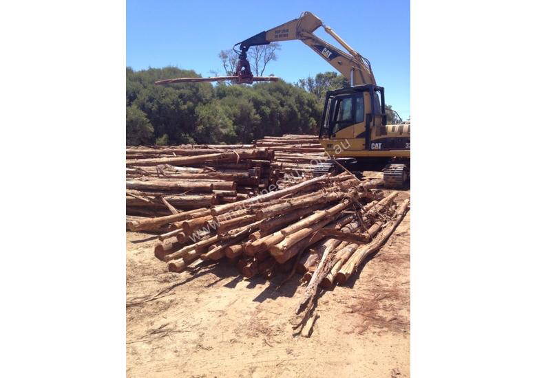 caption Cat 325C excavator with Randalls log grapple