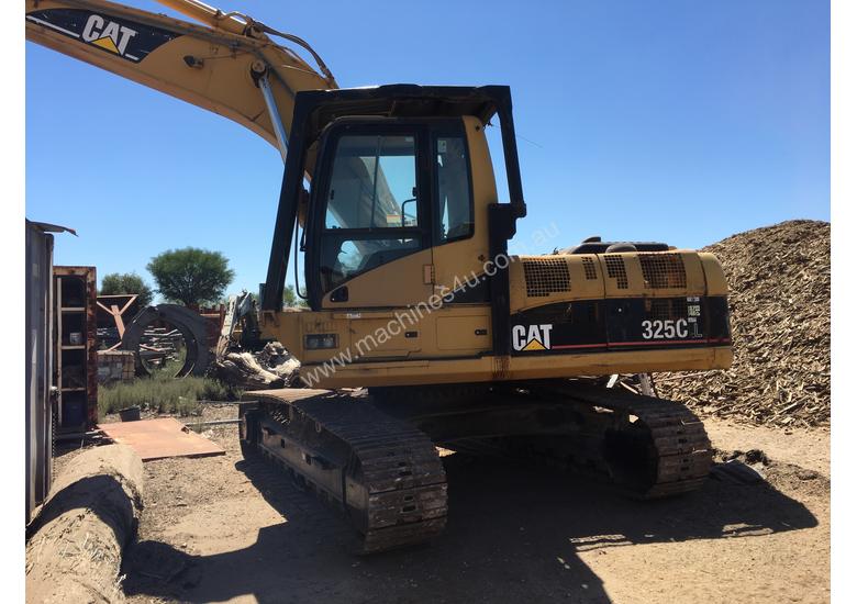 caption Cat 325C excavator with Randalls log grapple