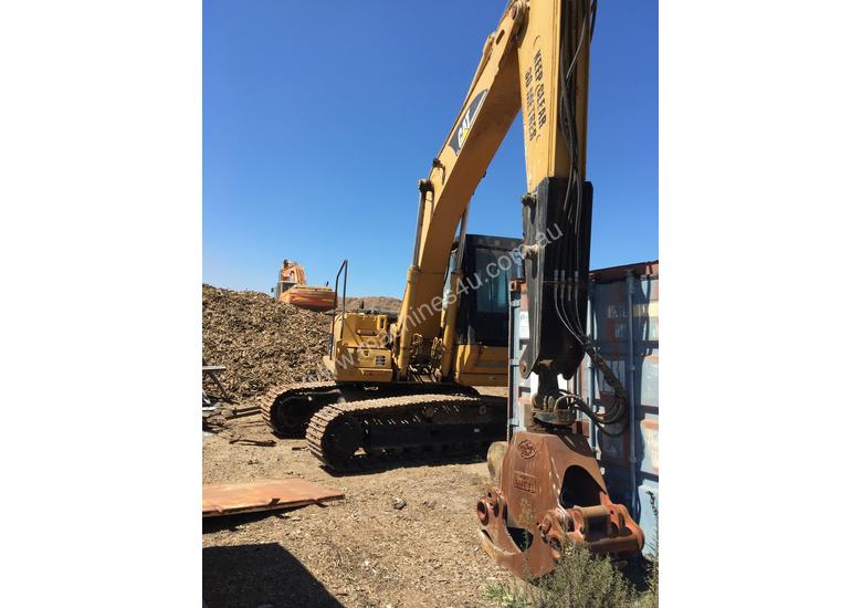 caption Cat 325C excavator with Randalls log grapple