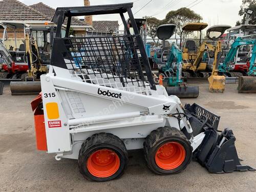 BOBCAT 315 with 4 in 1 bucket