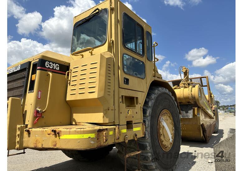 caption Caterpillar 631G Motor Scraper