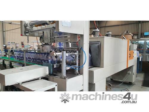 Complete sleeve machine including tunnel and steam generator