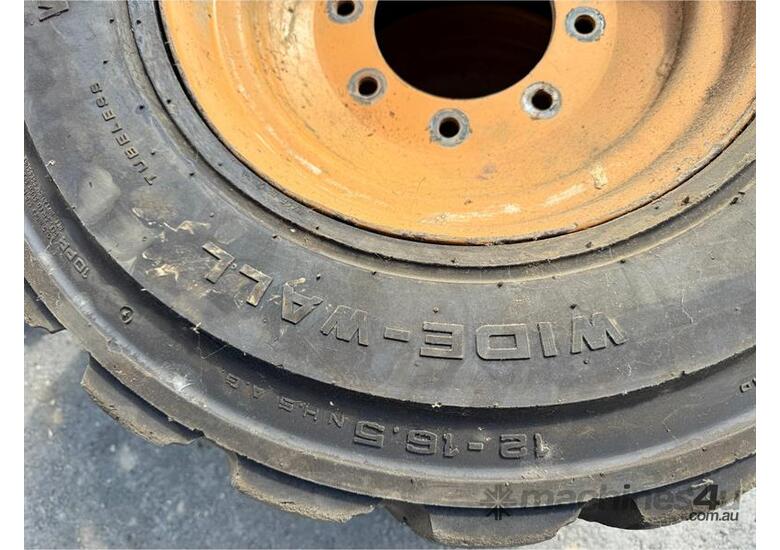 caption QTY X 3 SKID STEER TYRES