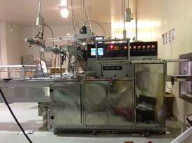 Flow Wrap Machine with automatic smart conveyor feeding  - picture0' - Click to enlarge