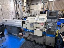 CNC Lathe Okuma LCS - 15 with Bartec Rapidfeed Auto Barloader, Part Catcher, Swarf Conveyor - picture0' - Click to enlarge