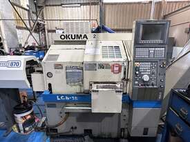 CNC Lathe Okuma LCS - 15 with Bartec Rapidfeed Auto Barloader, Part Catcher, Swarf Conveyor - picture0' - Click to enlarge