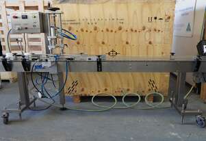 PACKSERV Auto Capper on conveyor