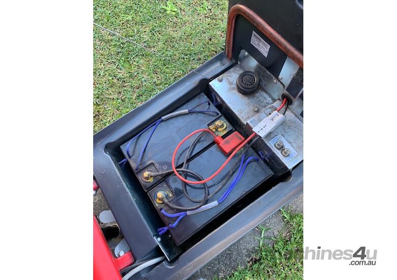 caption Commercial walk behind floor scrubber