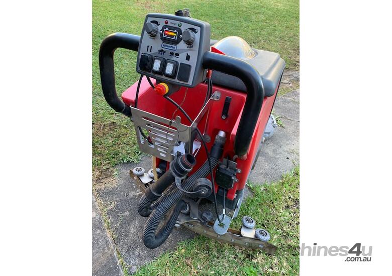 caption Commercial walk behind floor scrubber