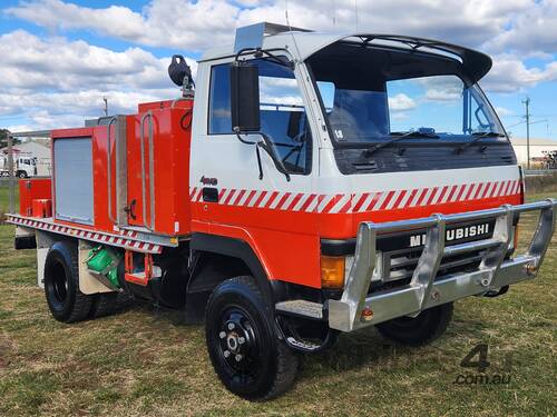 caption Mitsubishi Fuso Canter 4x4 Single Cab Firetruck. Ex NSW Rural Fire Service.