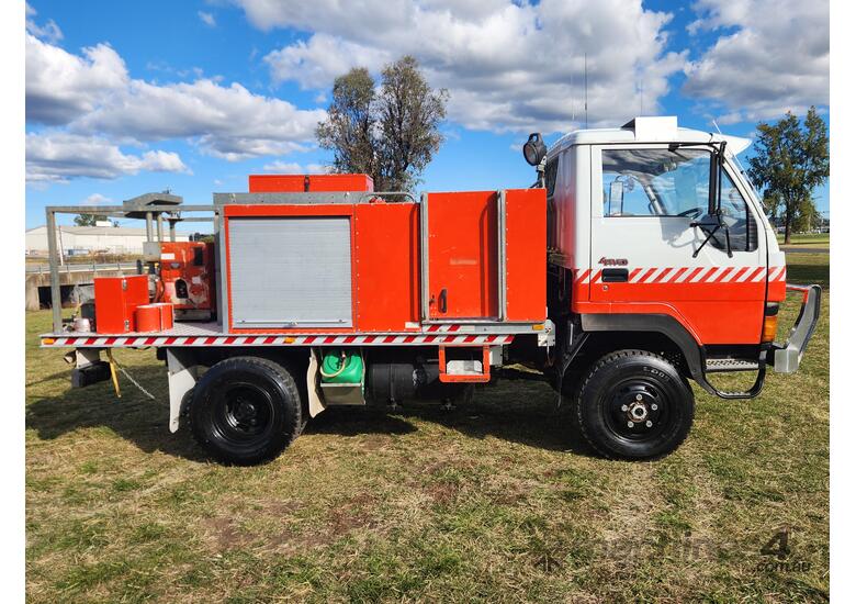 caption Mitsubishi Fuso Canter 4x4 Single Cab Firetruck. Ex NSW Rural Fire Service.