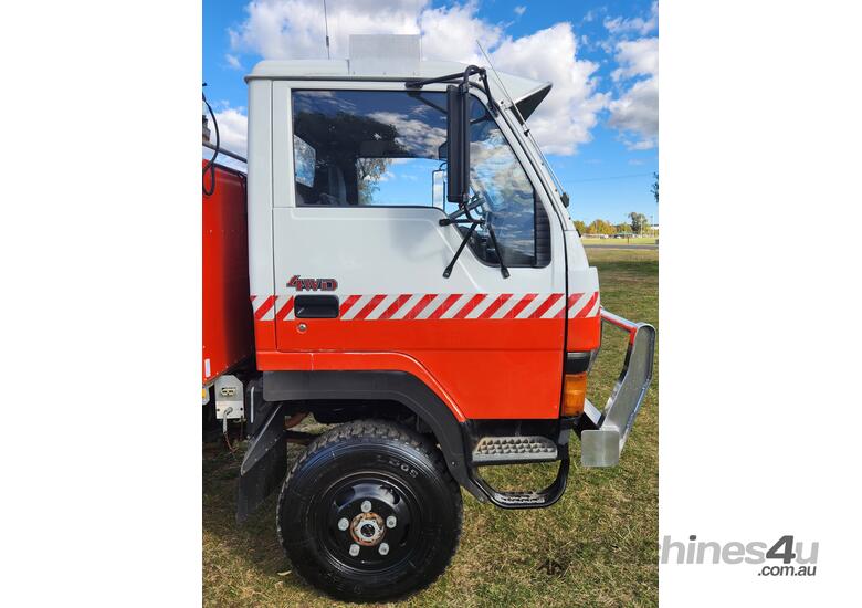 caption Mitsubishi Fuso Canter 4x4 Single Cab Firetruck. Ex NSW Rural Fire Service.