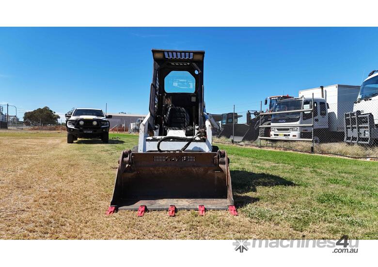 caption Bobcat 463 with Steel Trailer