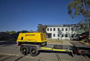 388CFM Diesel-Powered Rotary Screw Compressor with Safety Features, Mounted on Heavy-Duty Trailer