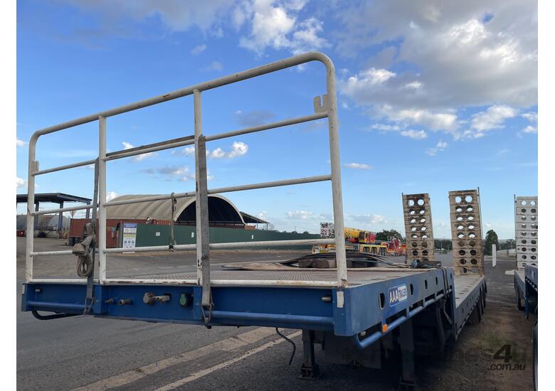 caption 2023 AAA Trailers MTAWLL Tri Axle Drop Deck Widener