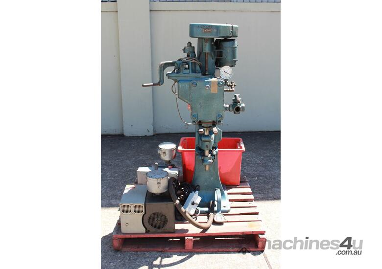 caption Vacuum Can Seamer.