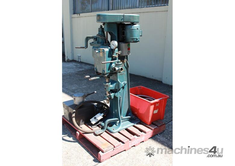 caption Vacuum Can Seamer.