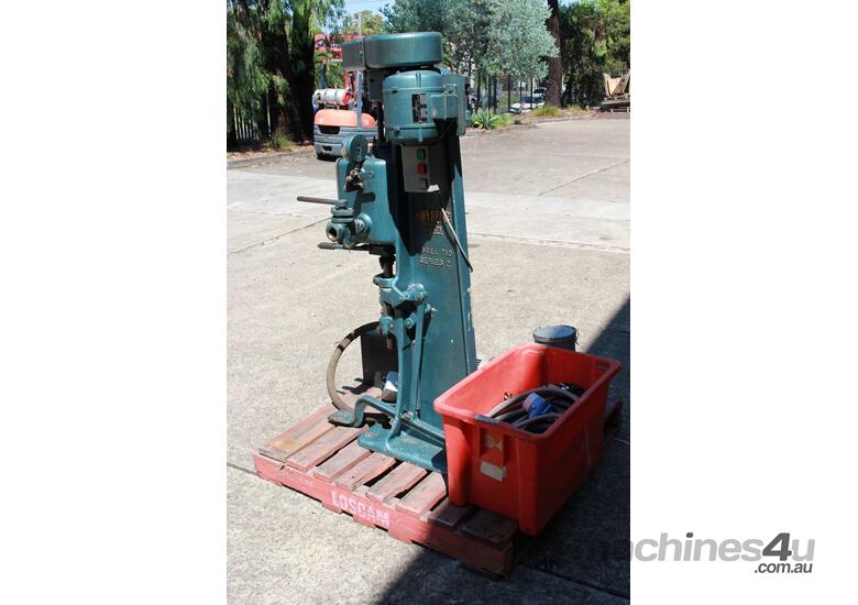 caption Vacuum Can Seamer.