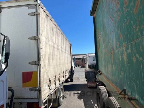 caption 2002 Nissan UD Curtainsider
