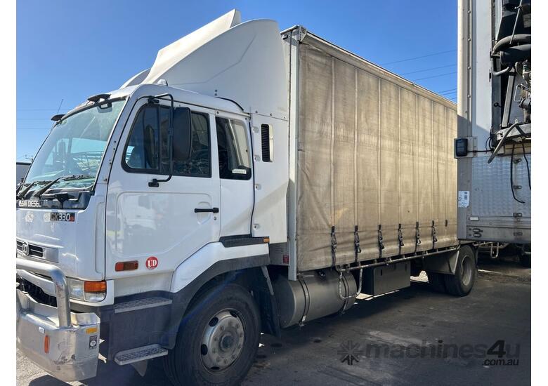 caption 2002 Nissan UD Curtainsider