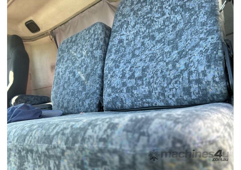 caption 2002 Nissan UD Curtainsider