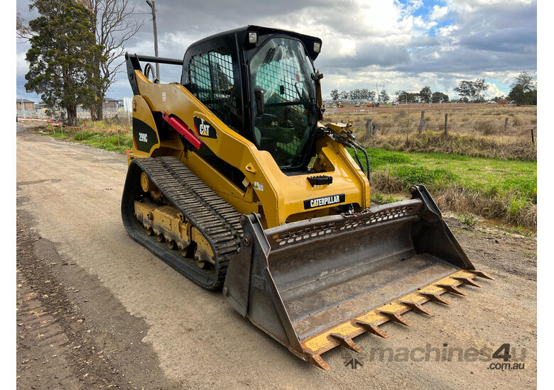 caption Caterpillar 299C Skid Steer Loader