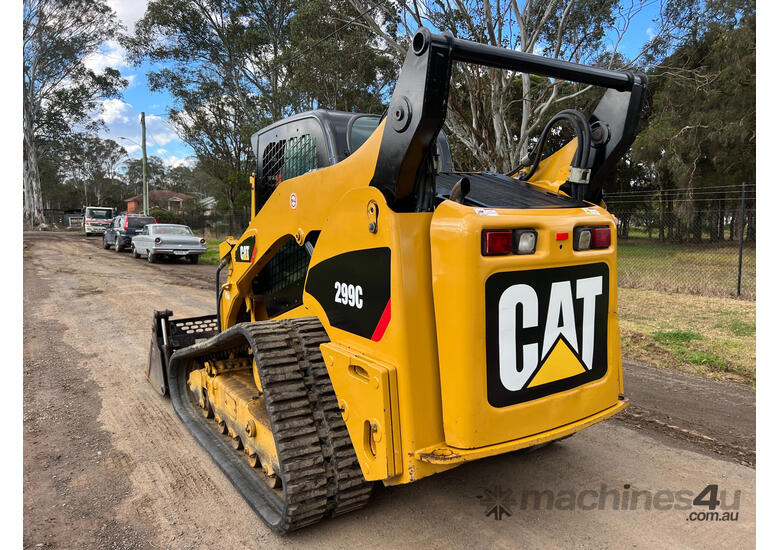 caption Caterpillar 299C Skid Steer Loader