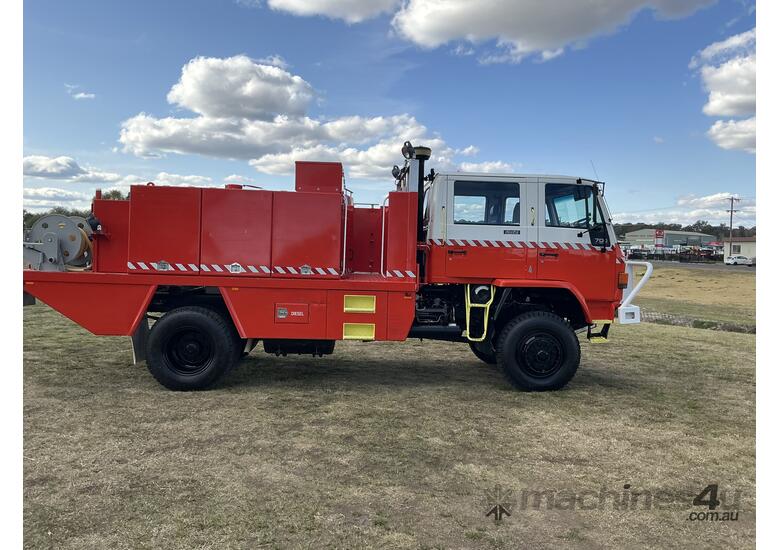 caption Isuzu FTS700 4x4 Dualcab Firetruck. Ex NSW Rural Fire Service.