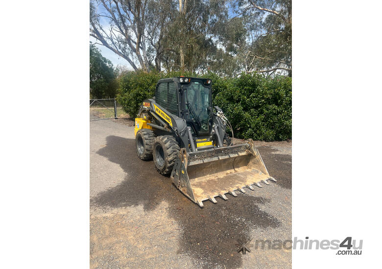 caption New Holland L320 Skid Steer Loader