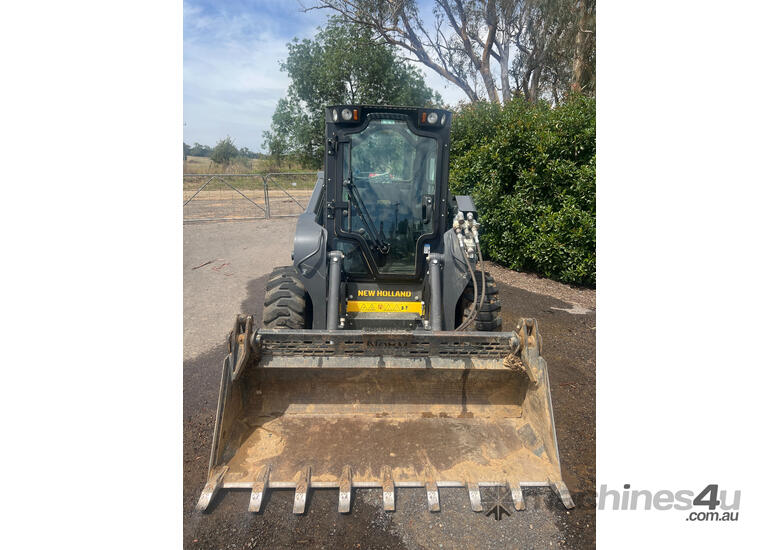 caption New Holland L320 Skid Steer Loader