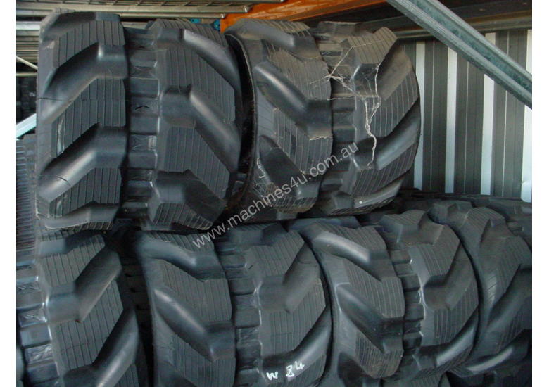 caption RUBBER TRACkS