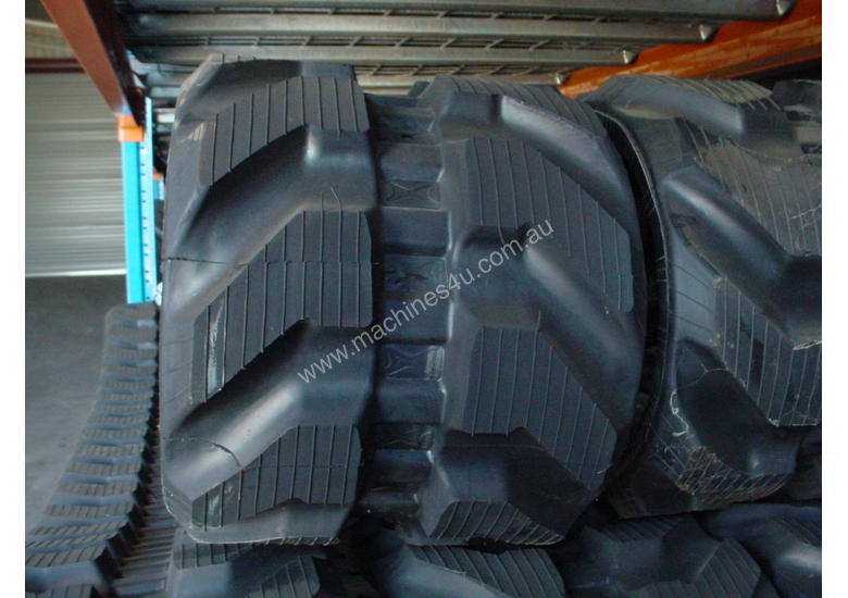 caption RUBBER TRACkS