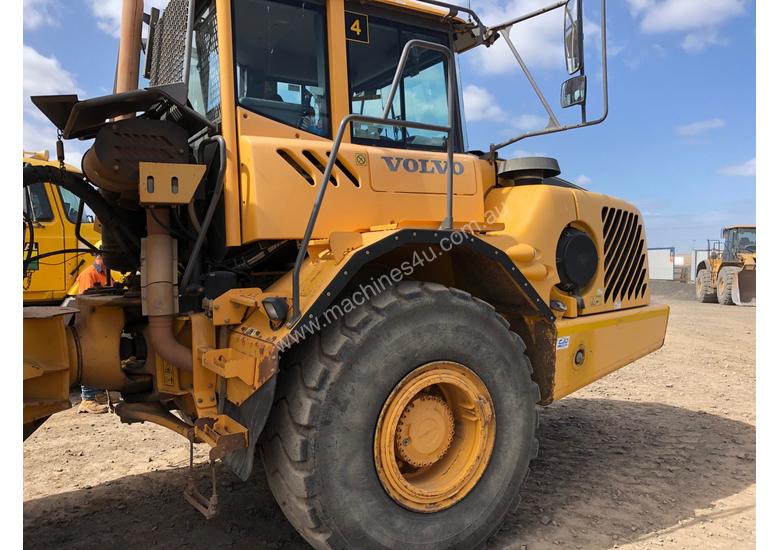caption Volvo A30E Water Cart & Truck