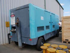 AIRMAN 1200cfm Portable Diesel Compressor on Wagon Wheels  - picture0' - Click to enlarge