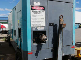 AIRMAN 1200cfm Portable Diesel Compressor on Wagon Wheels  - picture1' - Click to enlarge