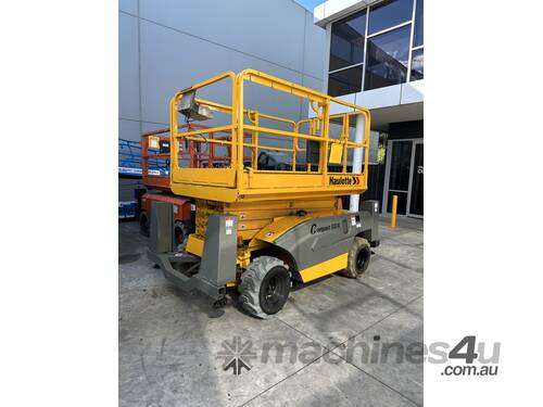 caption Haulotte Compact 12DX - 32ft Rough Terrain Scissor Lift