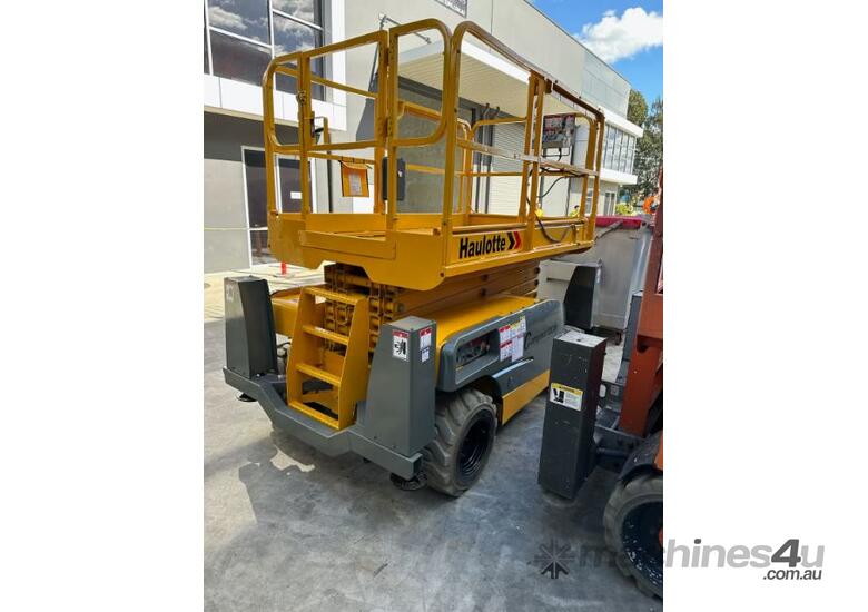 caption Haulotte Compact 12DX - 32ft Rough Terrain Scissor Lift