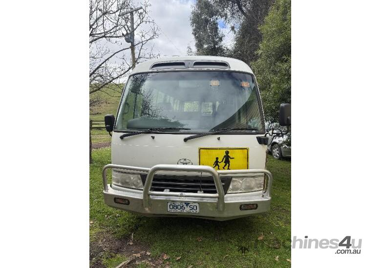 caption Toyota Coaster bus