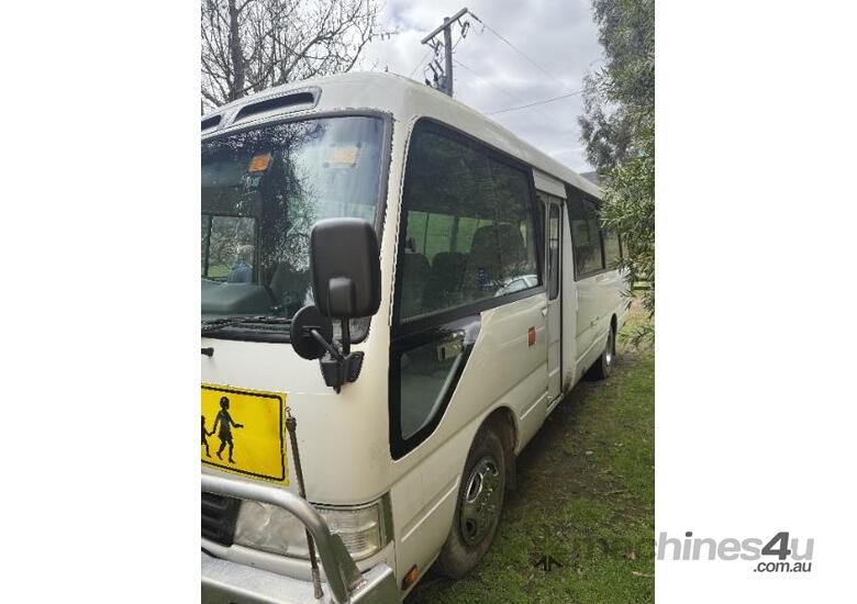 caption Toyota Coaster bus