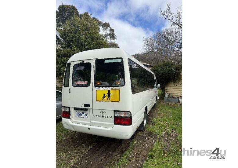 caption Toyota Coaster bus